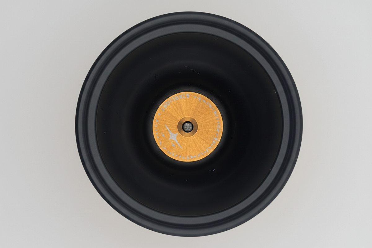 Black yoyo with gold center rotated left